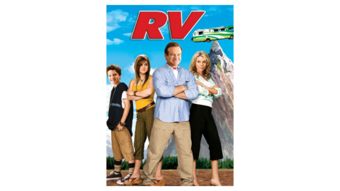 4 people standing at the base of a mountain that their camper is on