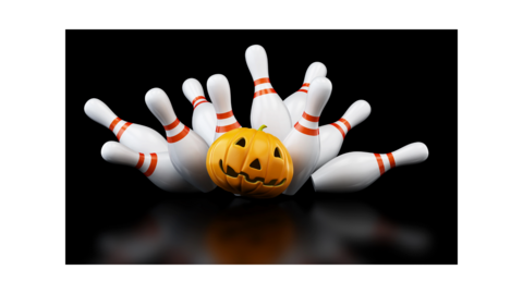 Bowling pins being knocked down by a pumpkin