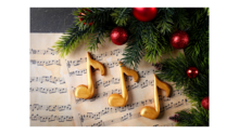 music notes next to a Christmas tree
